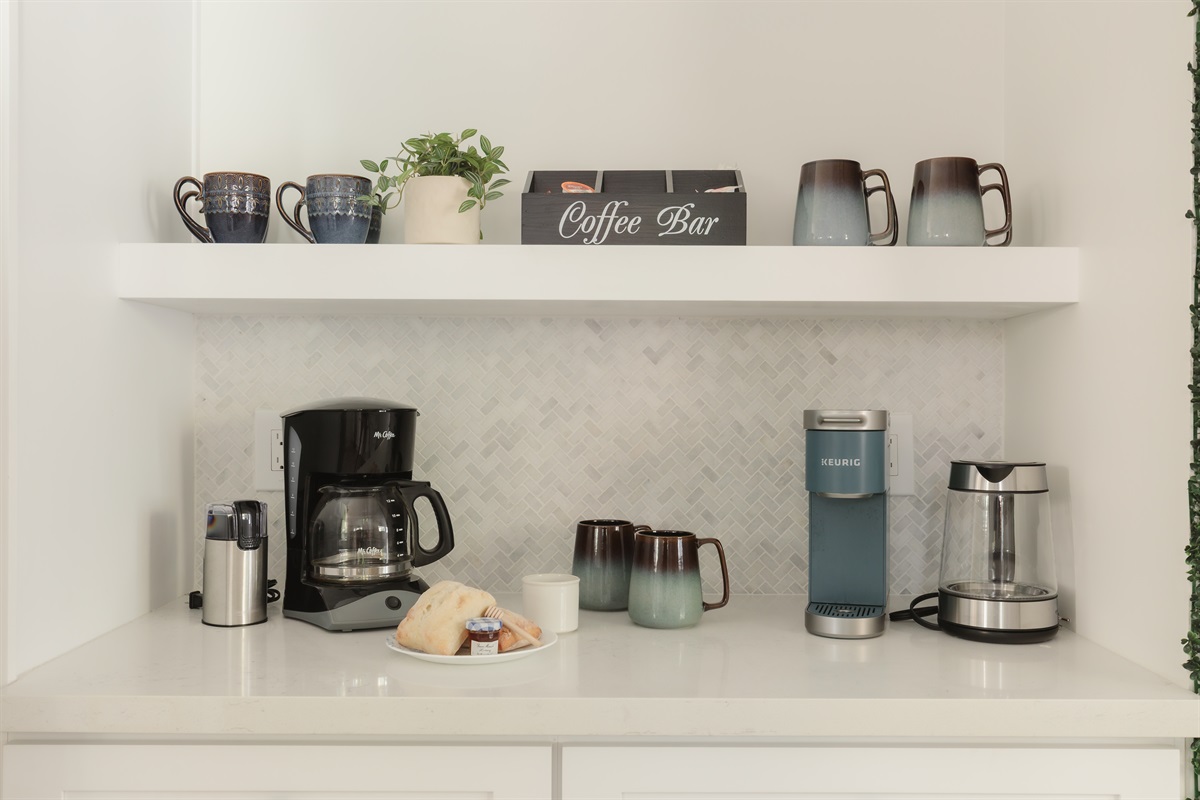 Your morning ritual, upgraded: Our coffee bar includes a drip machine, Keurig, grinder, and a variety of mugs so everyone can start the day their way.