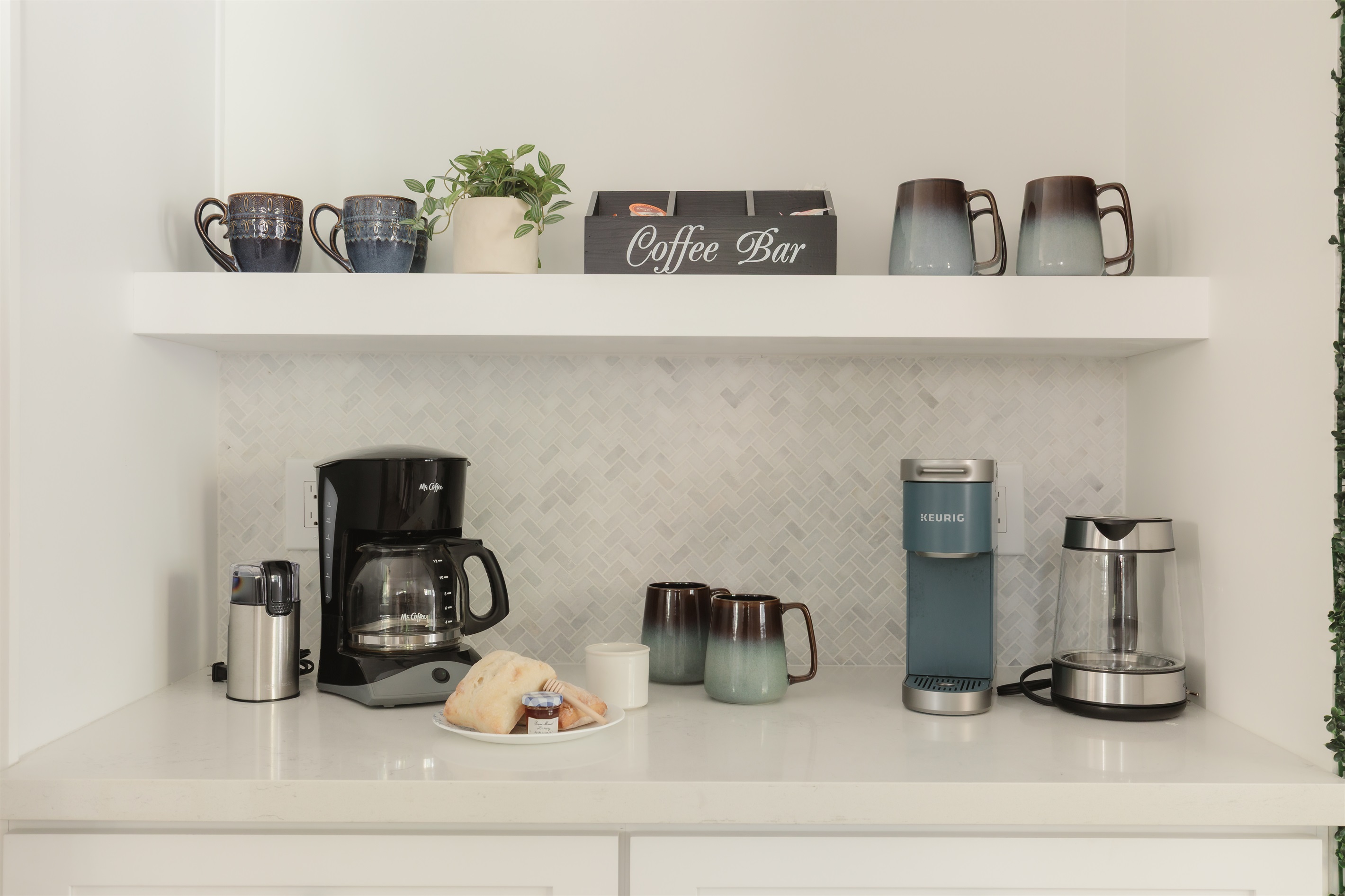 Your morning ritual, upgraded: Our coffee bar includes a drip machine, Keurig, grinder, and a variety of mugs so everyone can start the day their way.