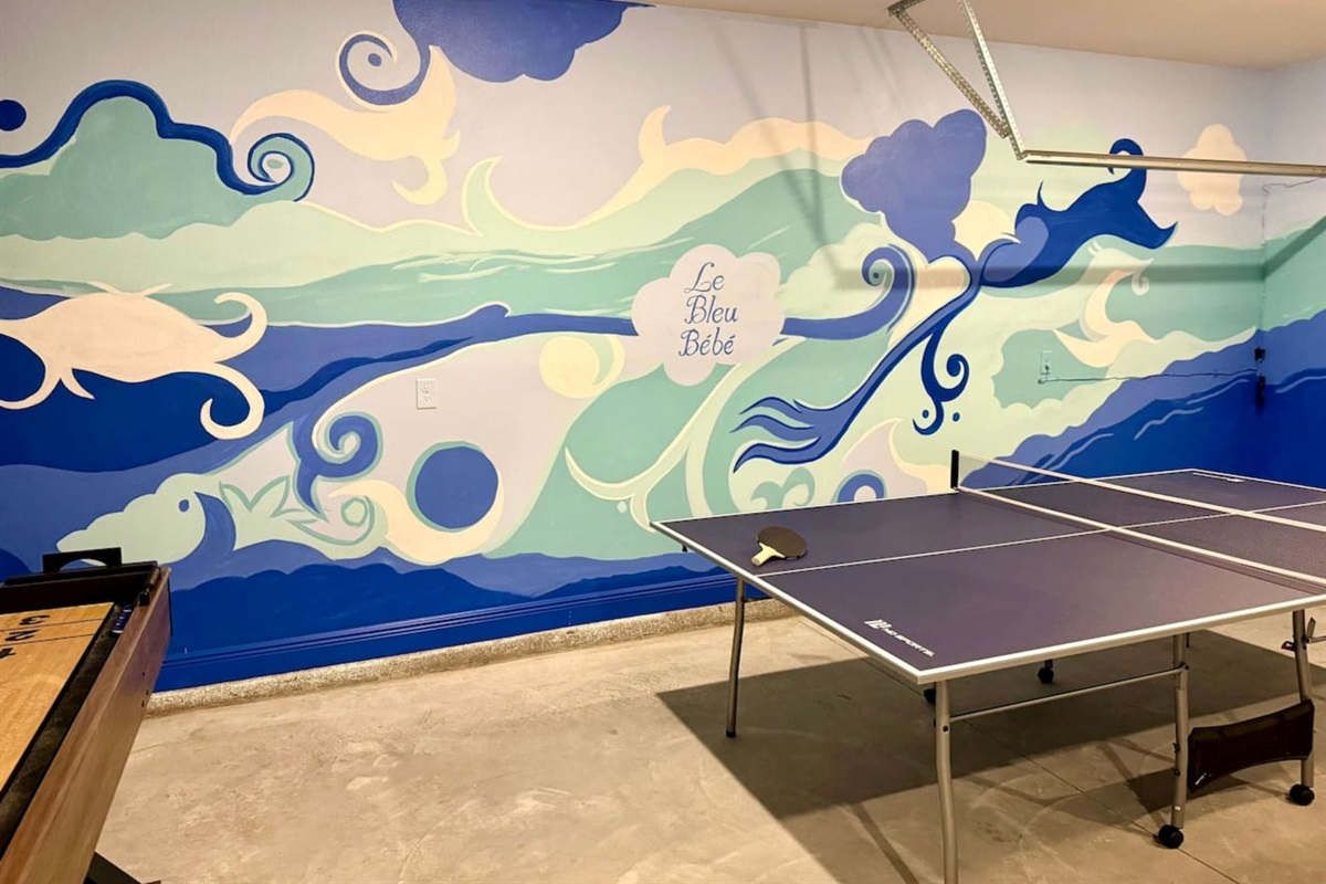 Fun-filled game room with arcade machines, ping pong, and shuffleboard—entertainment for all ages.