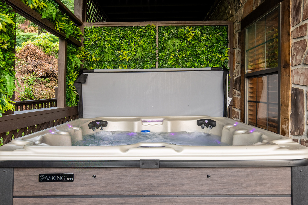 Relax in the 7-person hot tub while looking at the sun setting behind the Smoky Mountain views