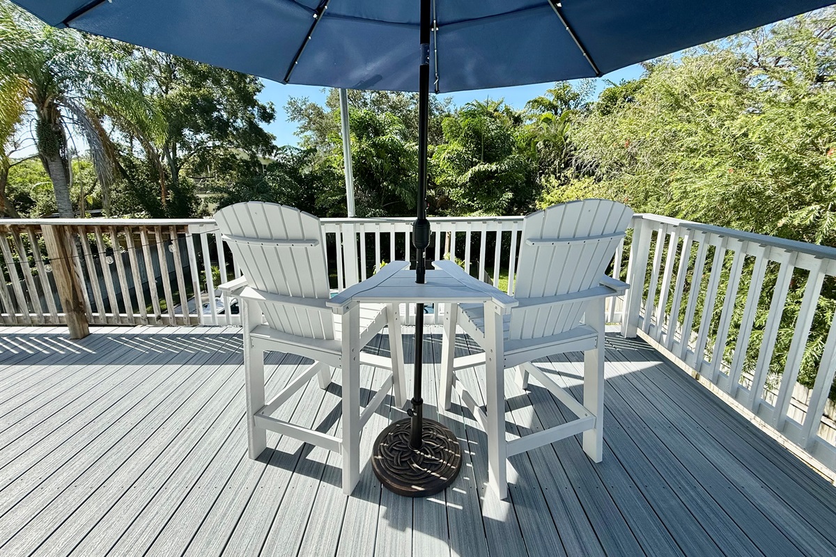 Take in lush greenery from this elevated deck — a serene space to relax and reconnect.