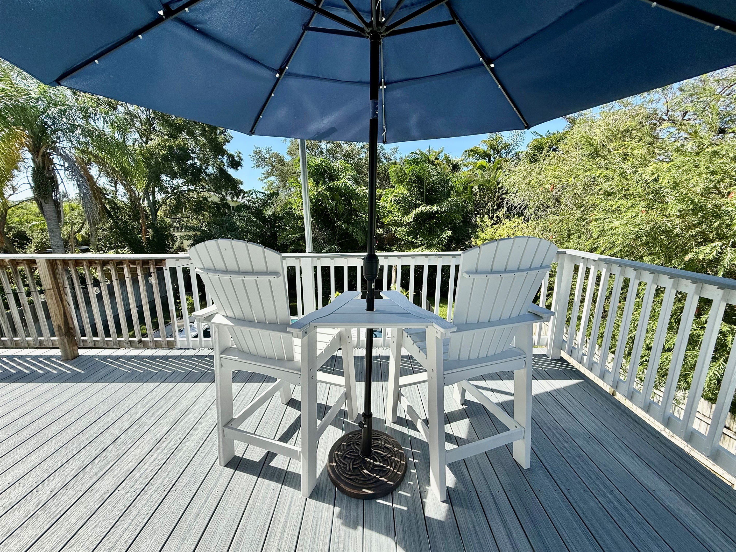 Take in lush greenery from this elevated deck — a serene space to relax and reconnect.