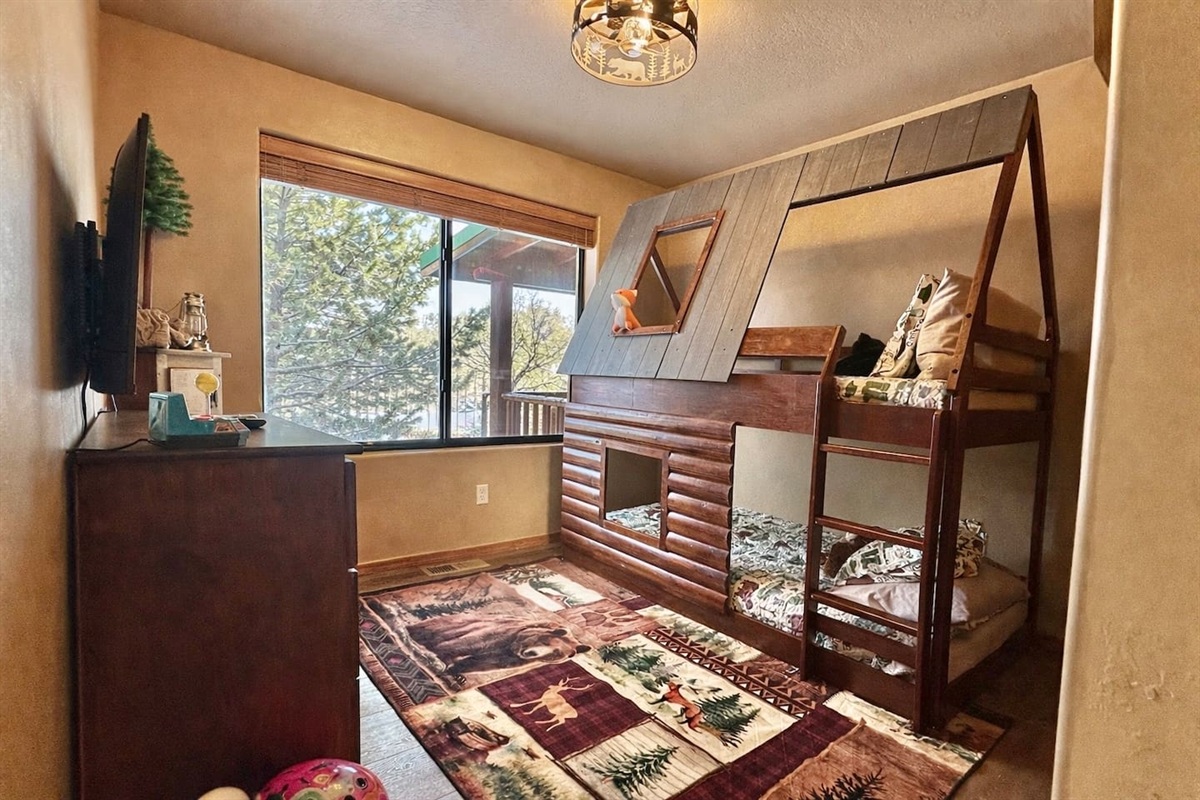 Log-style bunk room with two individual twin beds — kids love it.