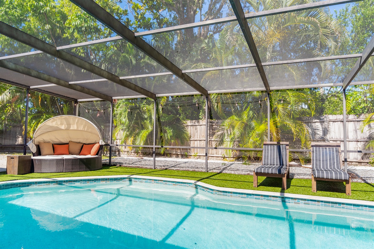 Covered and screened hot tub, ping pong, heated pool and patio.