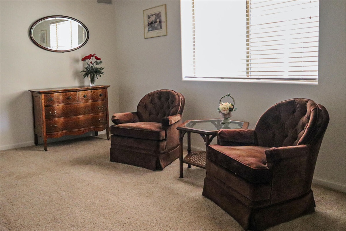 Primary bedroom with additional seating