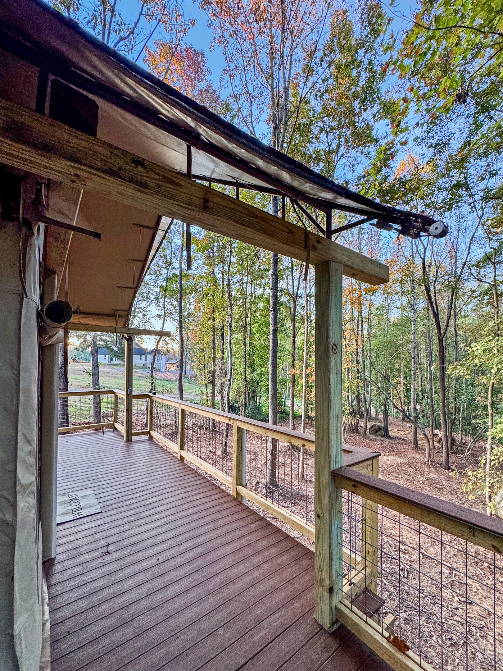 Deck: Enjoy morning coffee with stunning woodland views and fresh air in Troutman!
