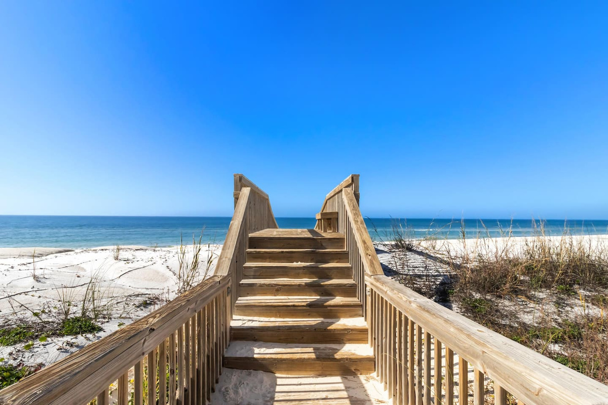 Walk the boardwalk down to the beach and feel the sand before your bags are even unpacked &mdash; the Gulf is that close.