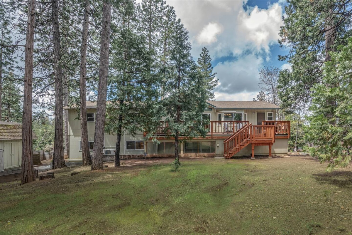 View of the back of the house showing horseshoes and deck