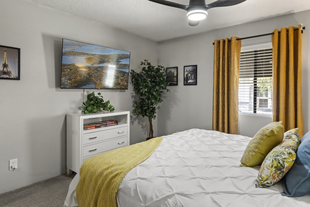 Settle in and enjoy a restful night in this cozy, thoughtfully decorated bedroom.