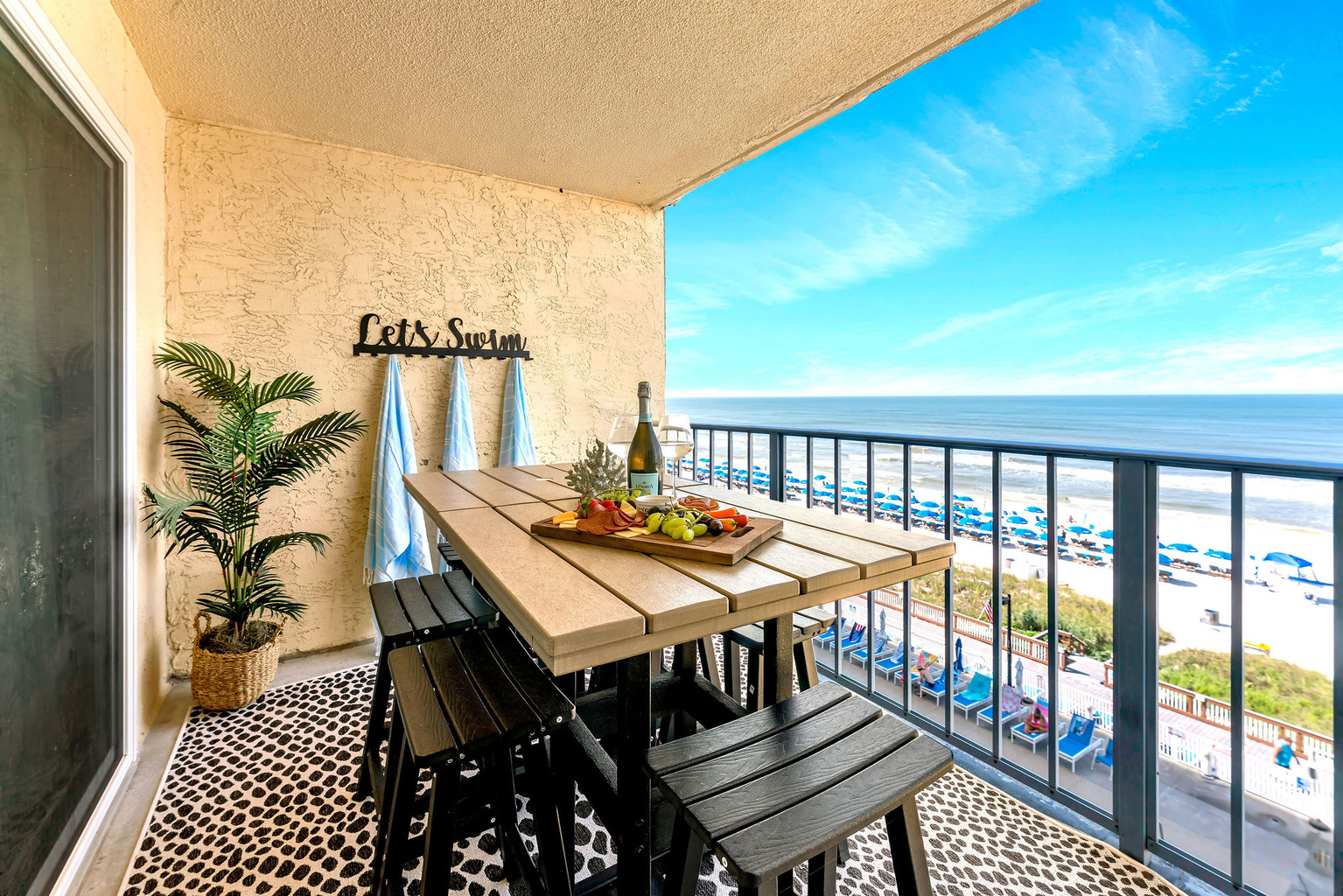 Your private oceanfront patio will become your hangout spot! Pour a glass of wine and relax at the polywood bar and dining table.