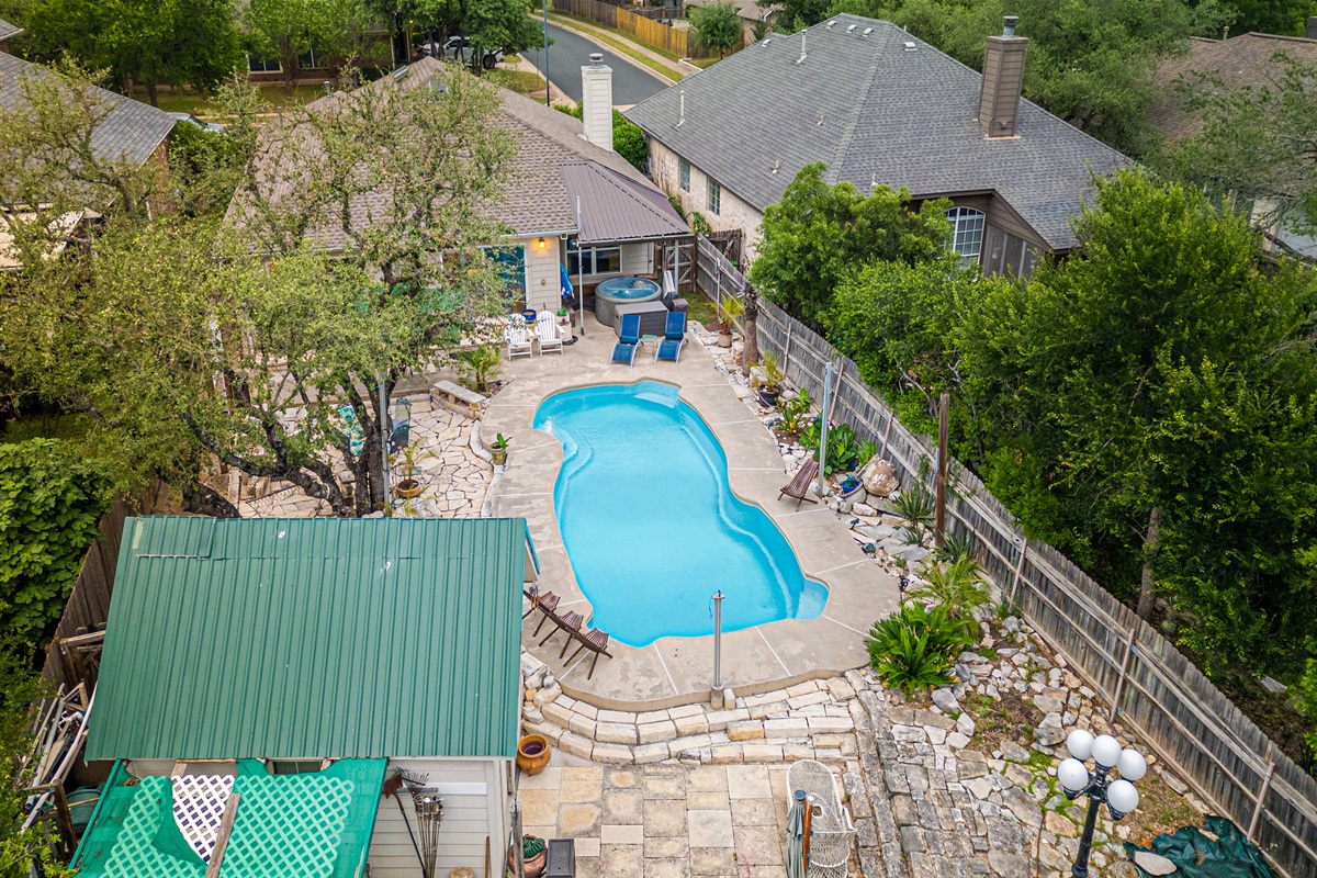 Welcome to your own private Backyard Oasis. Spa jets in pool bench seats & separate hot tub. Natural gas grill, oversized hammock for two, heated pool. Could it get any better?! Come, dive in ️
