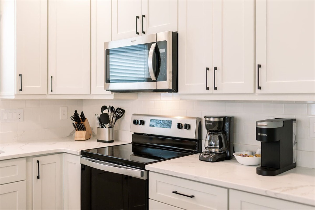 Enjoy both Keurig and drip coffee makers plus a fully stocked setup for home cooking.