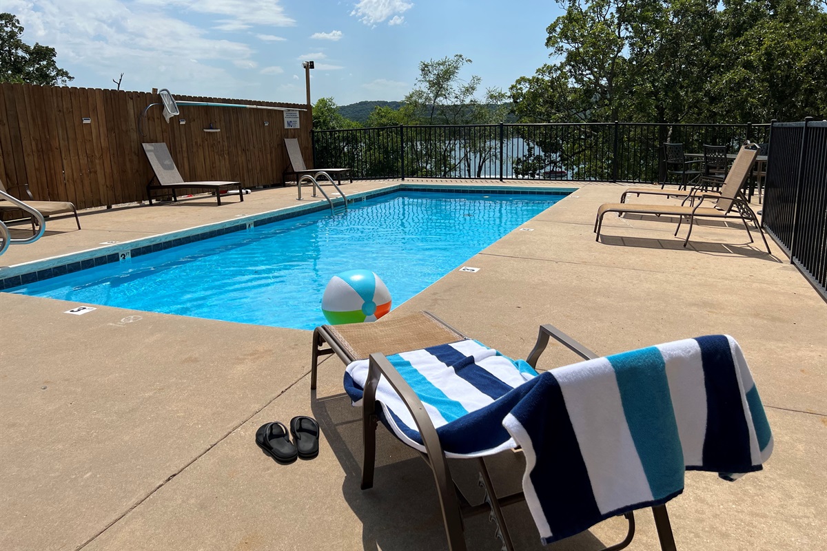The outdoor pool is right next to the condo and also has a beautiful view of the lake