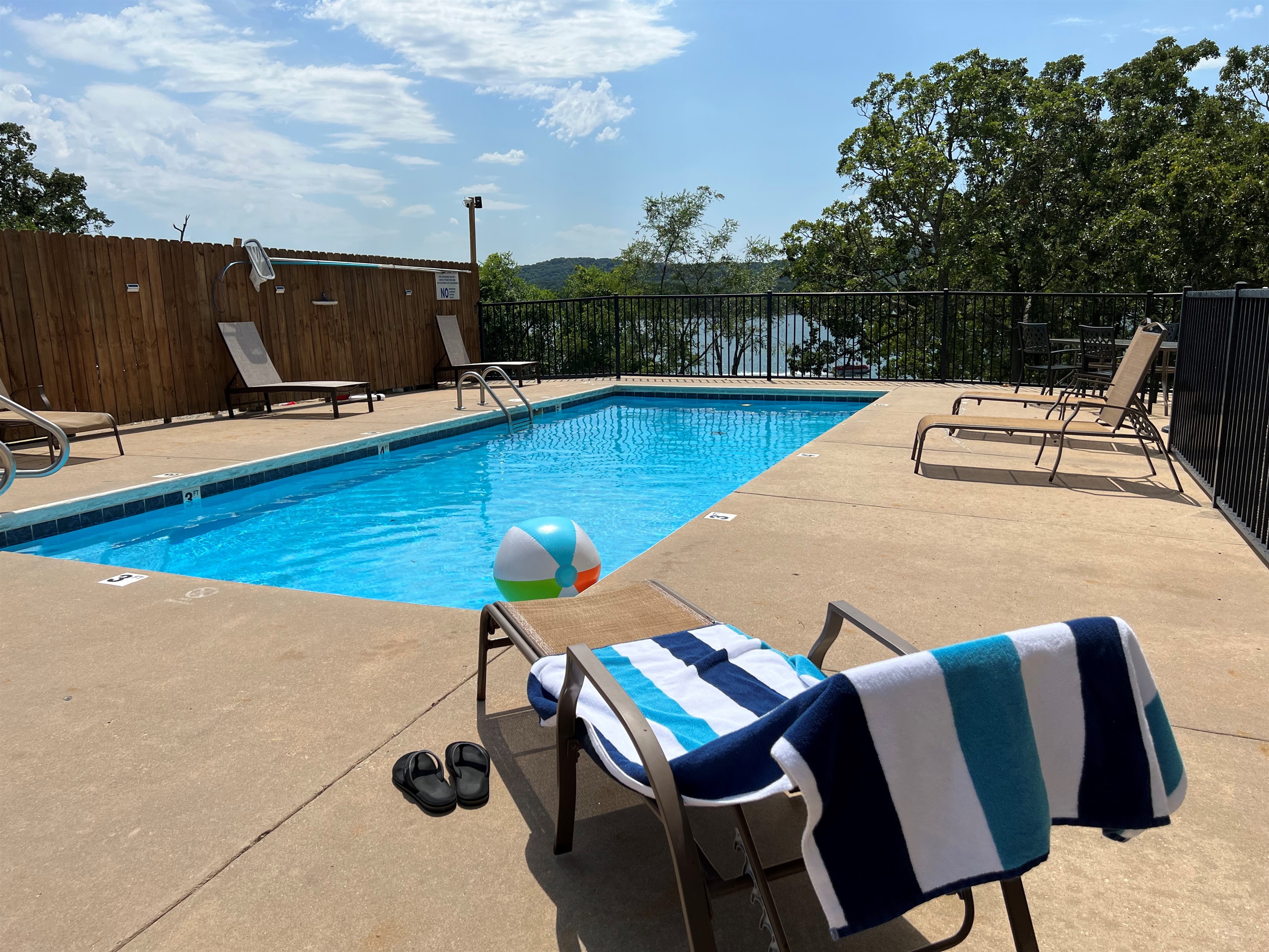 The outdoor pool is right next to the condo and also has a beautiful view of the lake