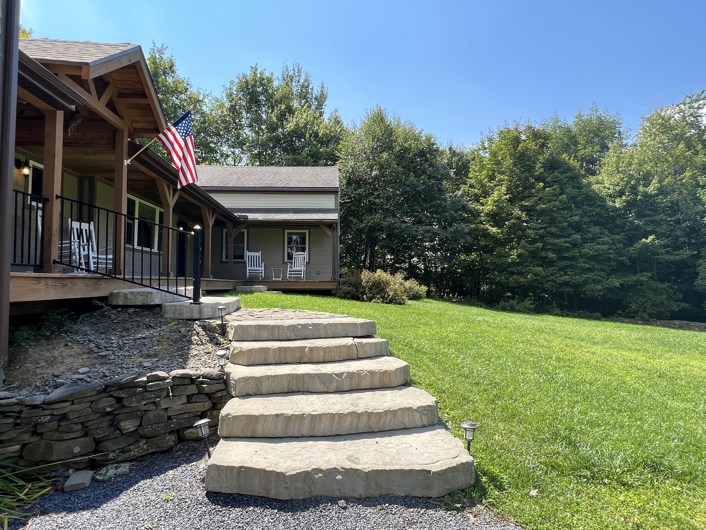Stairs leading up to the front porch for both units.