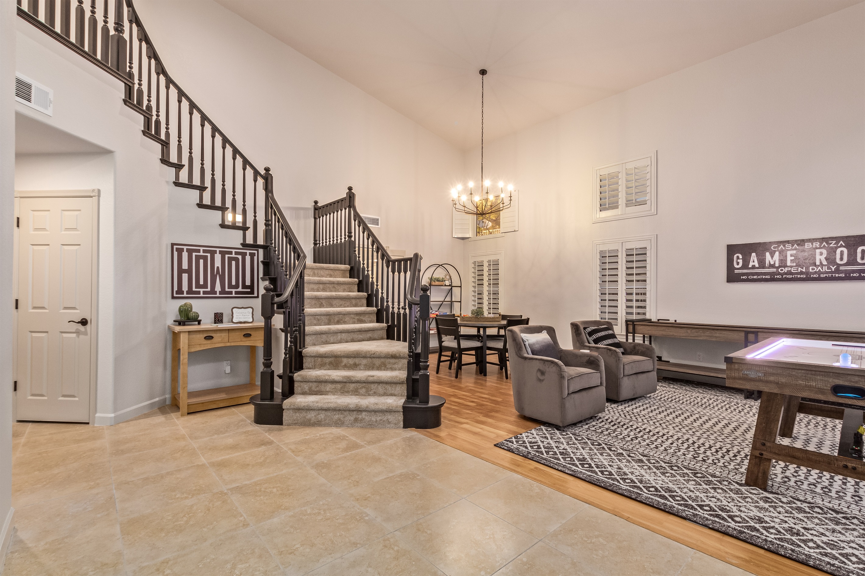 Front entry and game room with shuffle board and air hockey and family board games