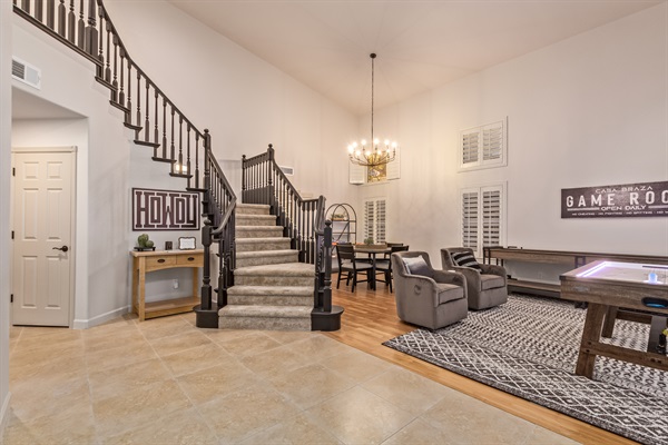 Front entry and game room with shuffle board and air hockey and family board games