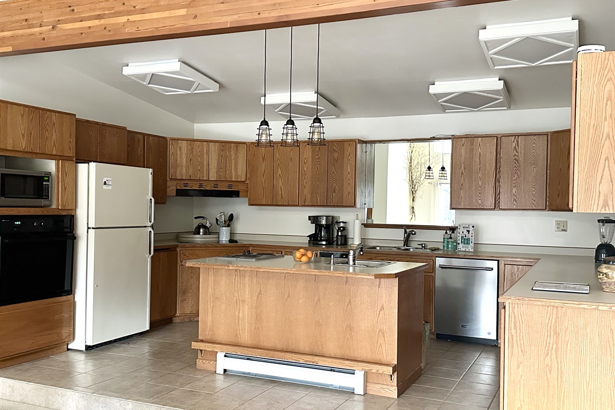 The large kitchen has microwave, oven, stove, and all pots and pans and utensils, etc. you would expect to find in your own kitchen.