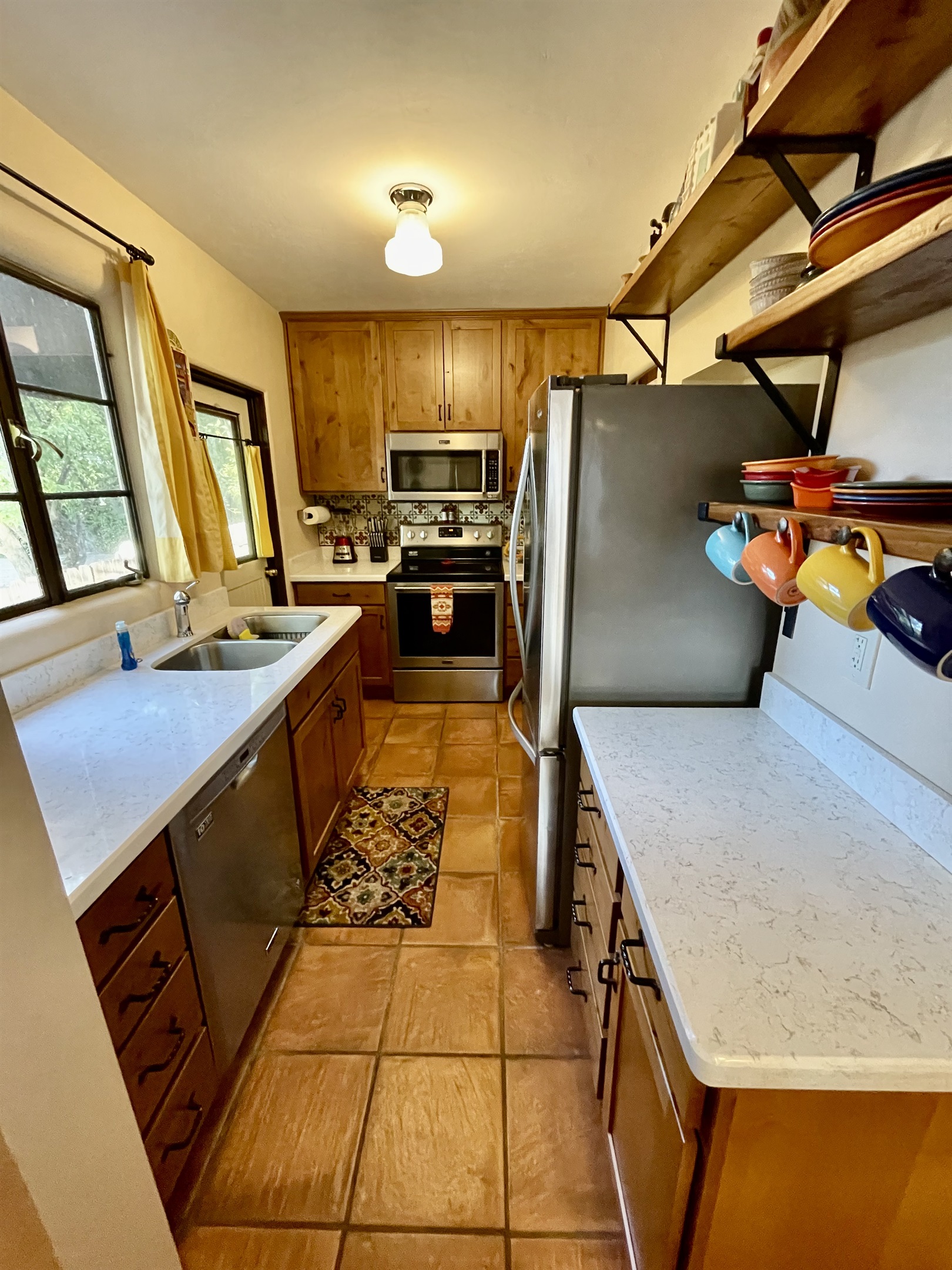 Cooking is a breeze in this fully equipped kitchen, featuring modern appliances and ample counter space.