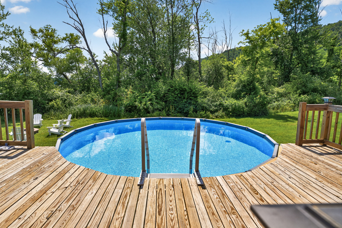 Above-ground pool with surrounding deck