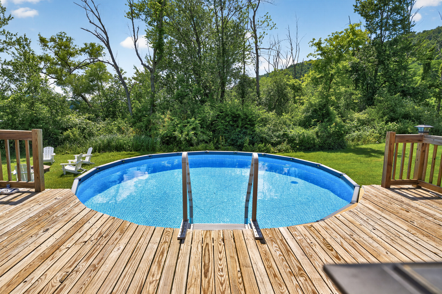 Above-ground pool with surrounding deck