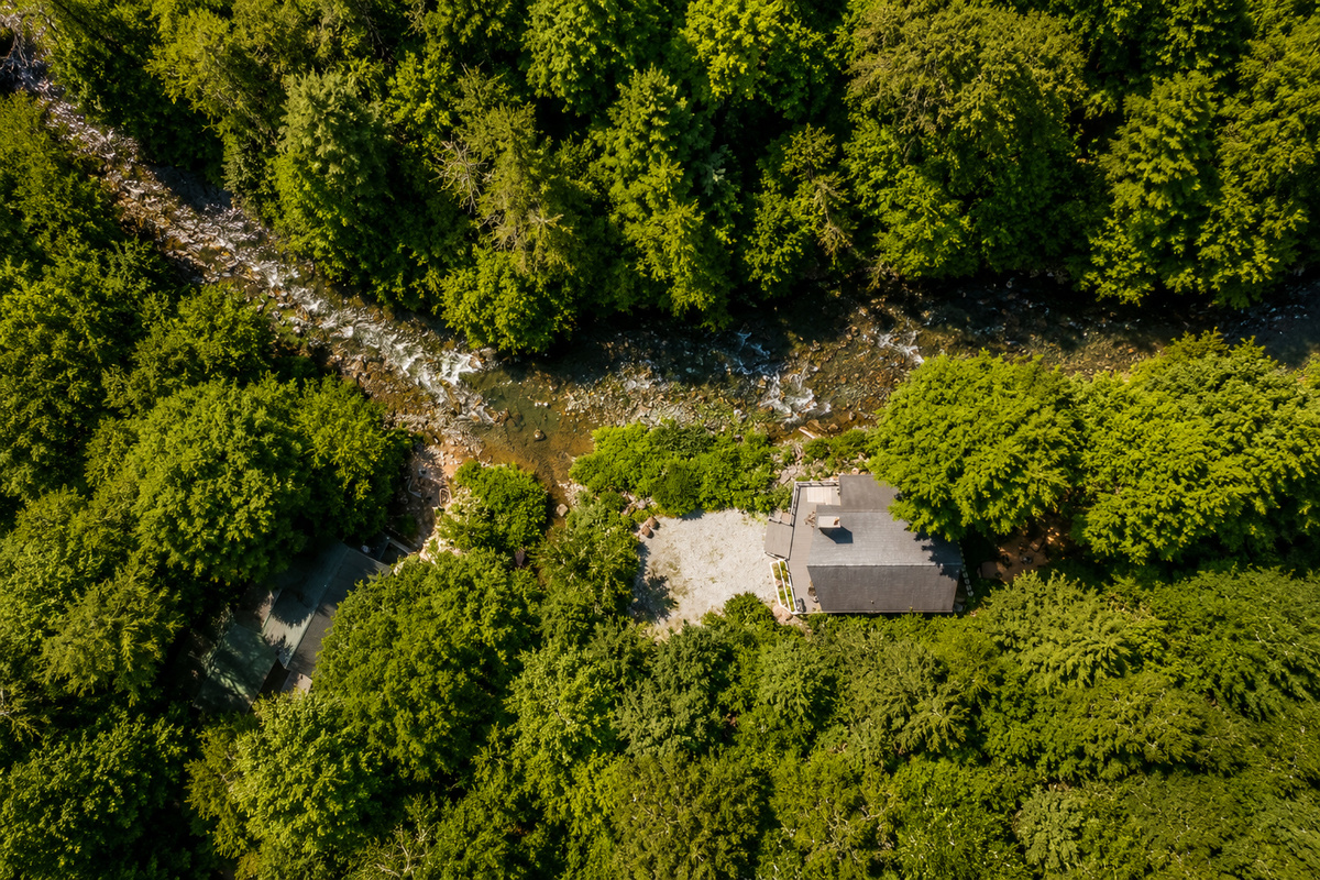 Aerial view of home and river 