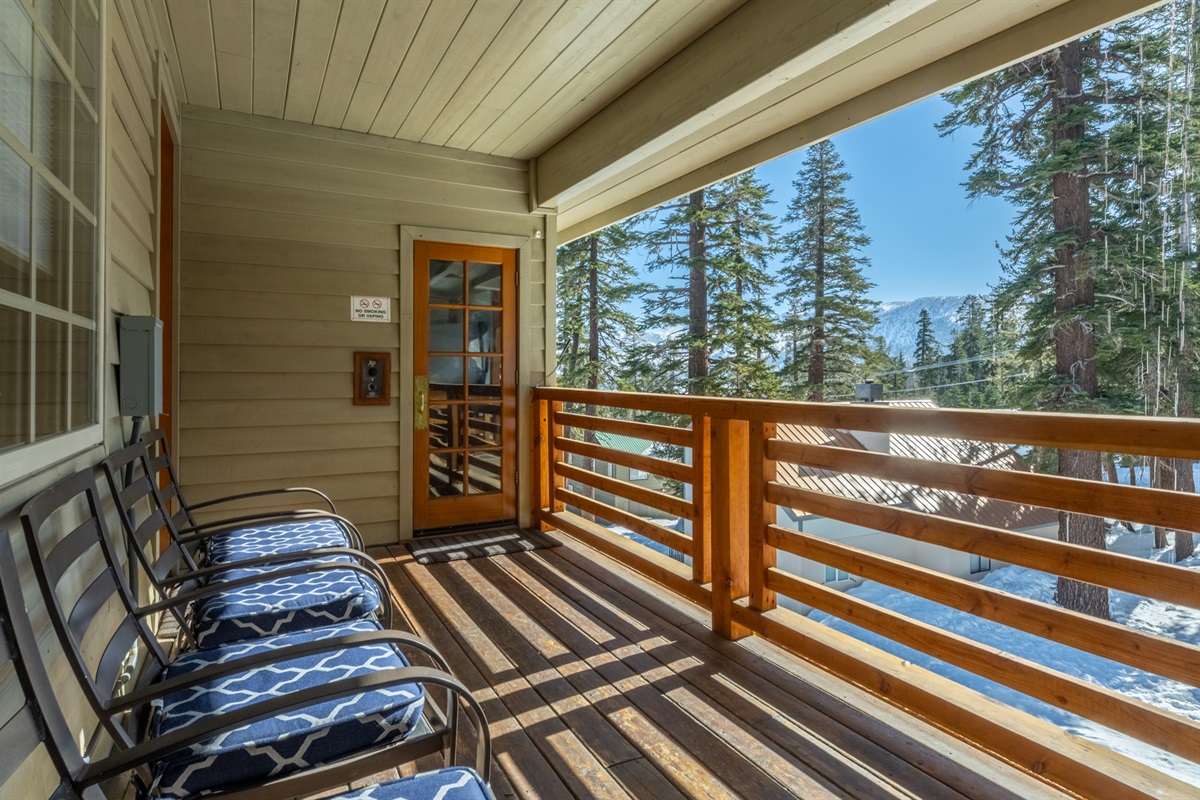 Comfortable balcony seating with mountain views—an inviting spot to unwind.