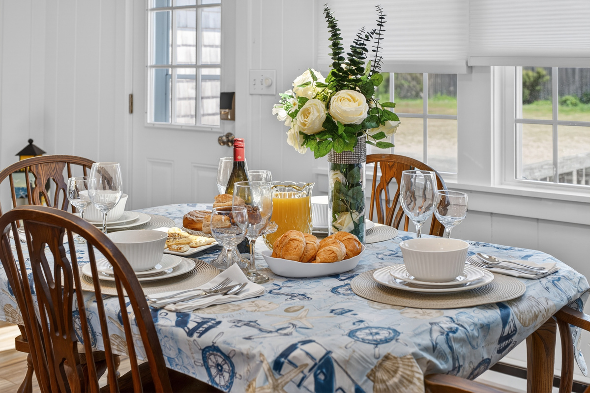 Intimate dining space for four, perfect for special occasions and shared moments.