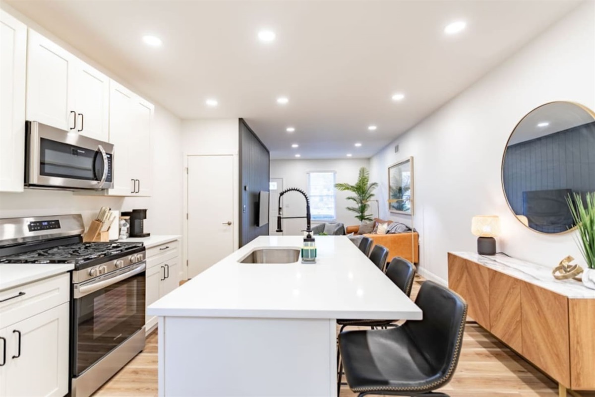 Full side view of the kitchen, highlighting its spacious layout and modern appliances.