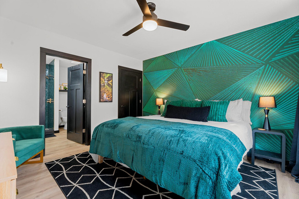 Sleep in serene luxury in the main level king suite designed for rest, comfort, and quiet mornings
