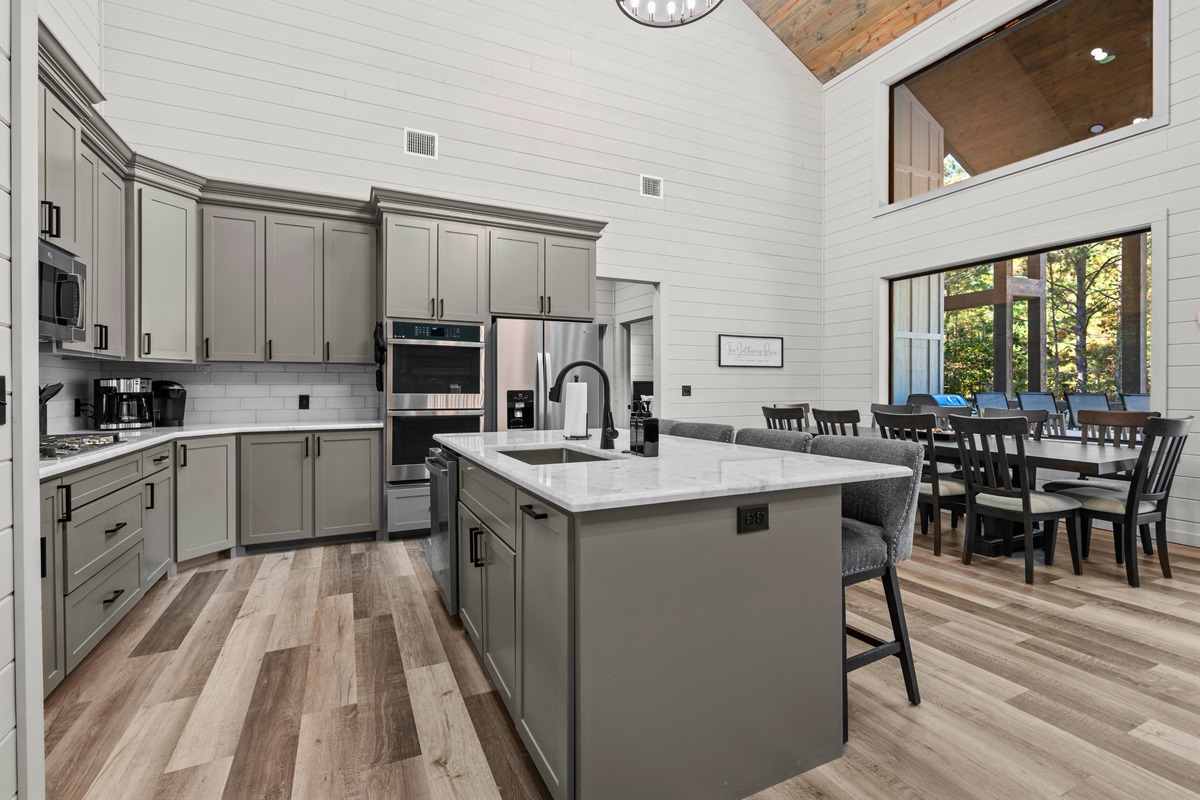 Bright, open, and beautifully designed, the kitchen invites everyone to gather around and join in the cooking.