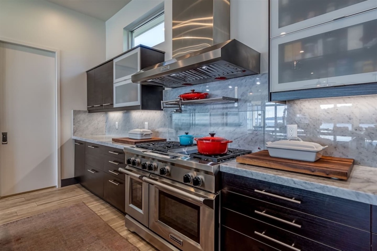 Six burner stove and vent hood.