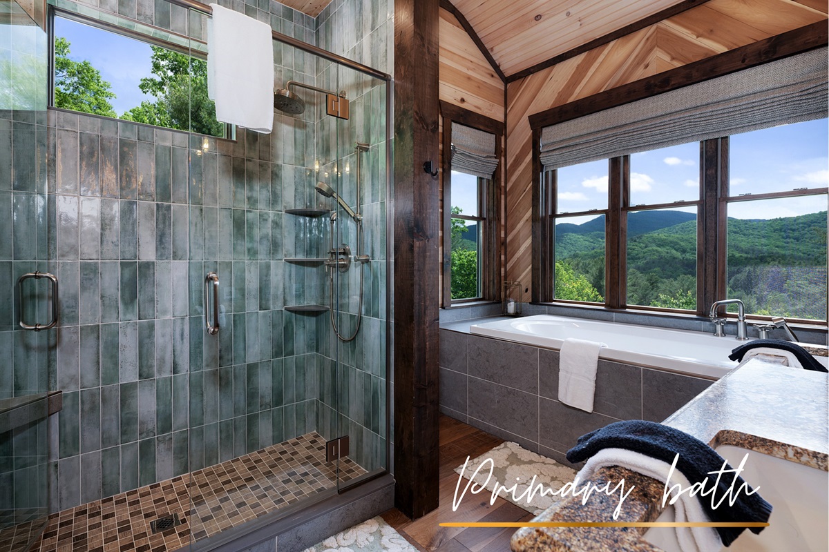 Refresh in this beautifully tiled bathroom, featuring a walk-in shower and plenty of natural light.