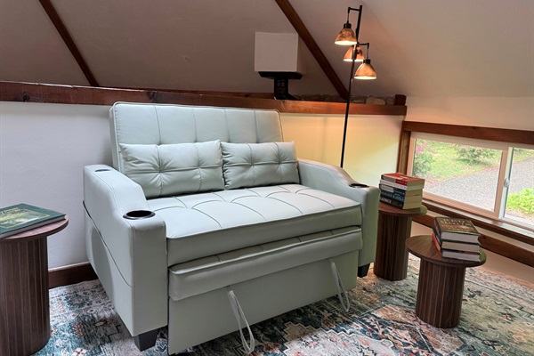 Sleeper chair and reading nook in the loft area