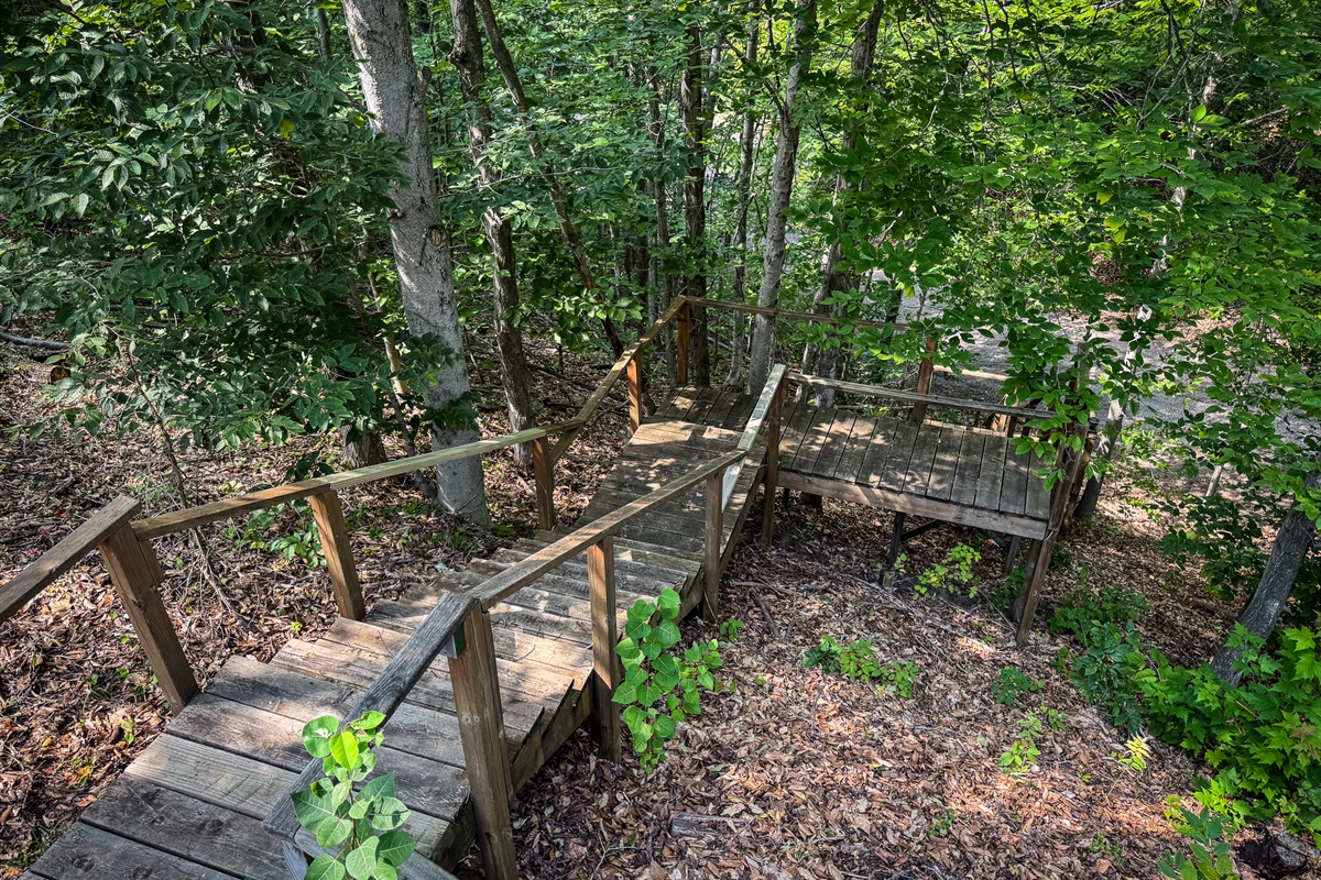 Stairs going down to the additional parking area and main association drive