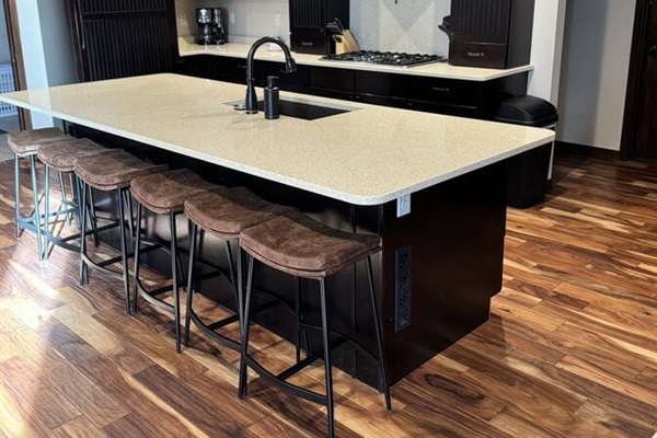 Chef's Kitchen with large island and seating - great for family breakfasts and group cooking.