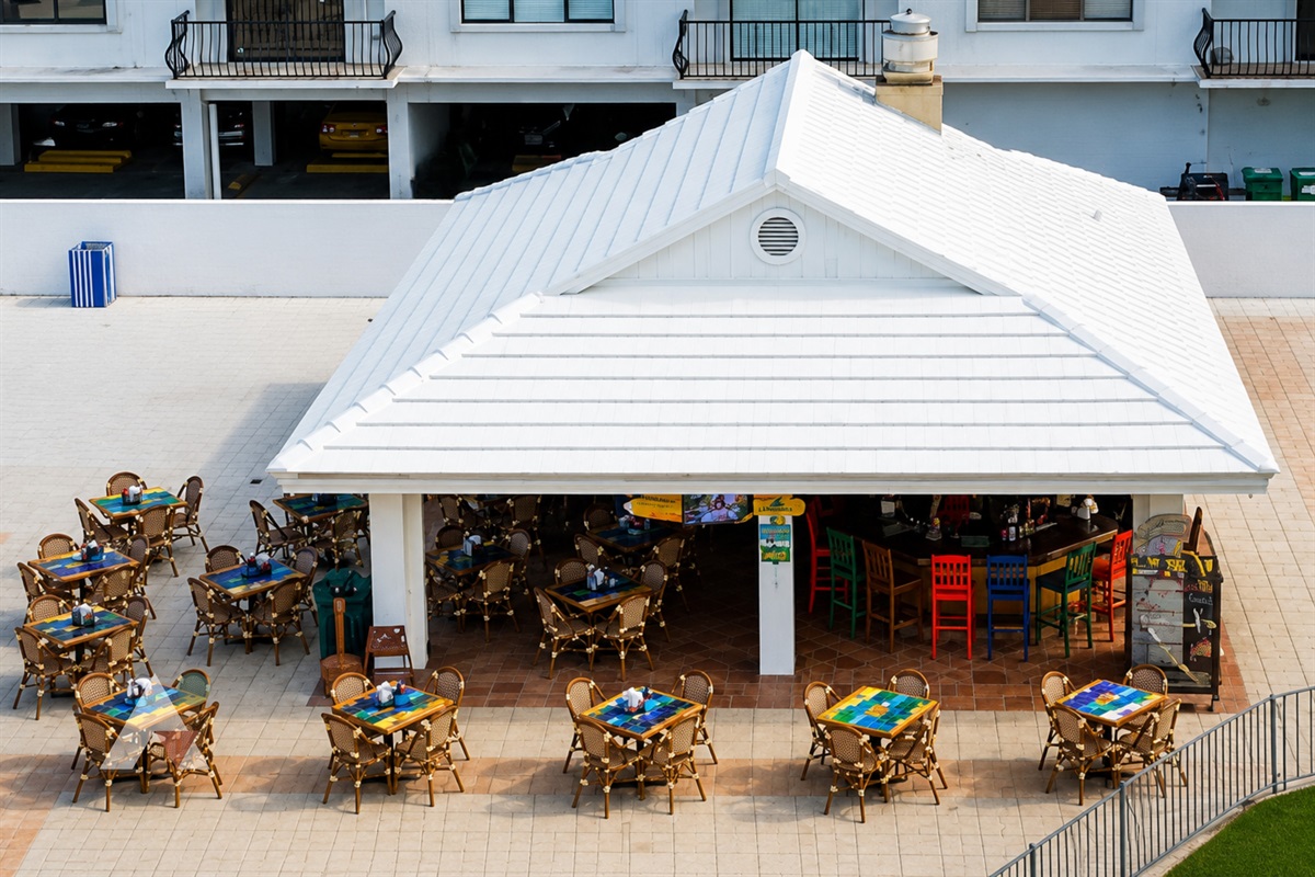 The poolside tiki bar serves tropical drinks and casual bites just steps from the pool and the sand.