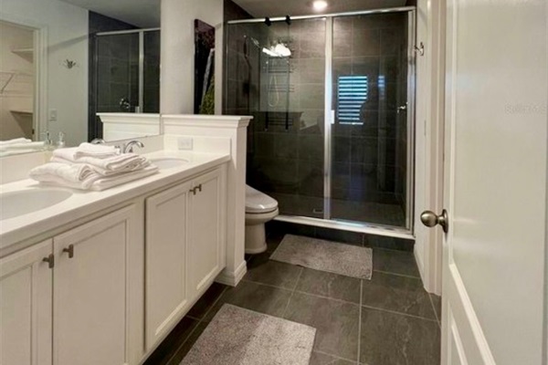 Bathroom 1 with Walk in shower and dual vanity mirror