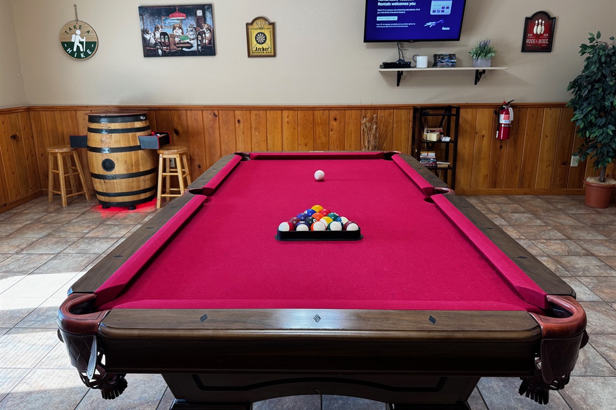 Billiards, football, arcade system, large TV, table, games, and more to help people stay busy -- if they choose!