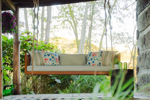 Swing into serenity on the cozy porch, surrounded by nature.
