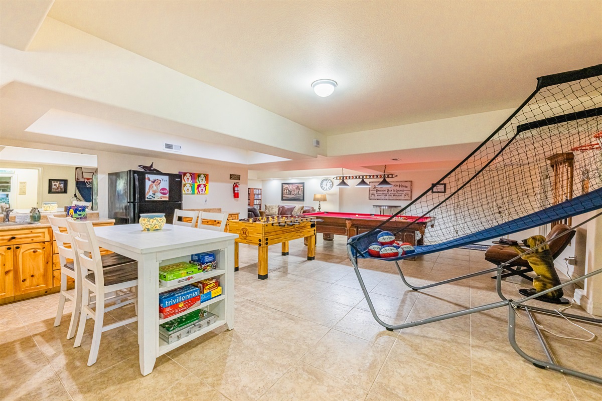 Basement game room is made for fun!! Wet bar, 2nd refrigerator, game/puzzle table, "Pop-a-Shot" Basketball game, Foos Ball Table, 1969 Brunswick Classic 9' Slate Pool Table, 65" Smart TV & DVD player w/hundreds of DVD's to choose from.