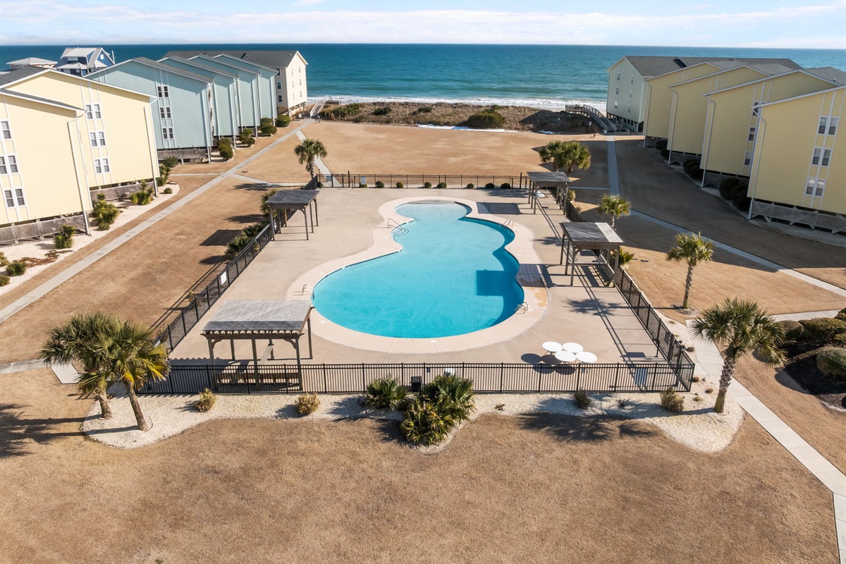 Aerial view of Surf Condos&rsquo; pool, just steps from the ocean