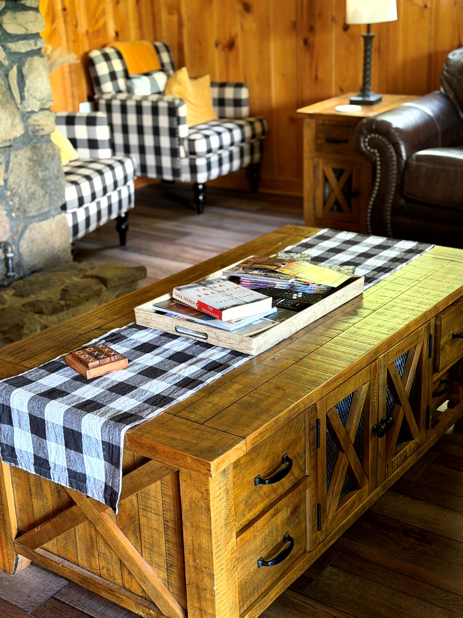 Cozy living room at Grey Haven — settle in with cabin charm, comfy seating, and space to unwind.  