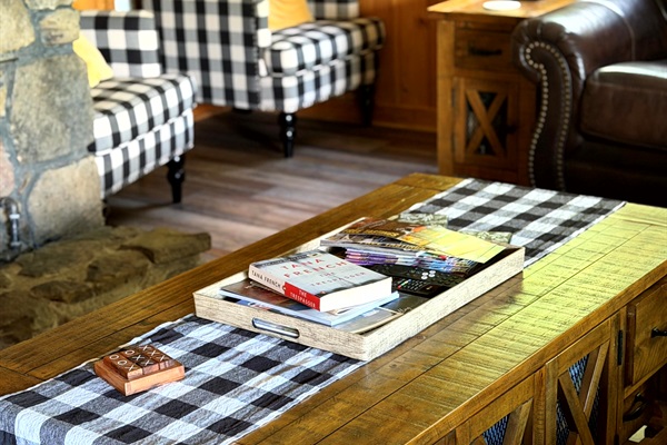 Cozy living room at Grey Haven — settle in with cabin charm, comfy seating, and space to unwind.  