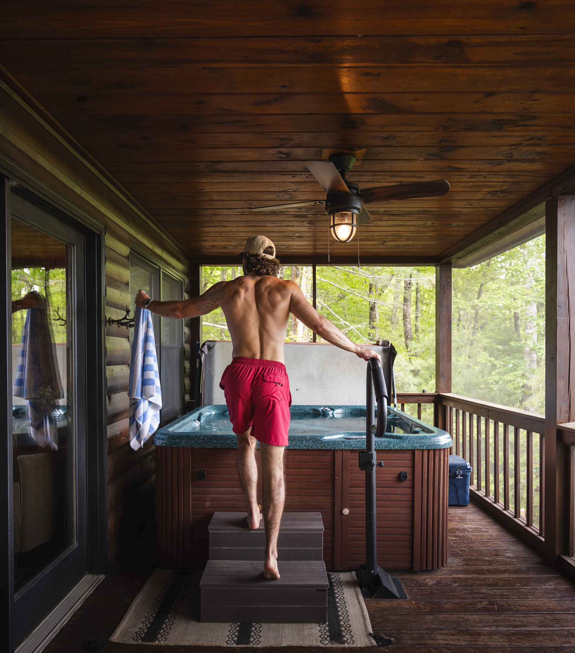 Climb into the private hot tub on the screened-in porch, just off the living room making it an easy transition from indoor comfort to mountain relaxation. 
