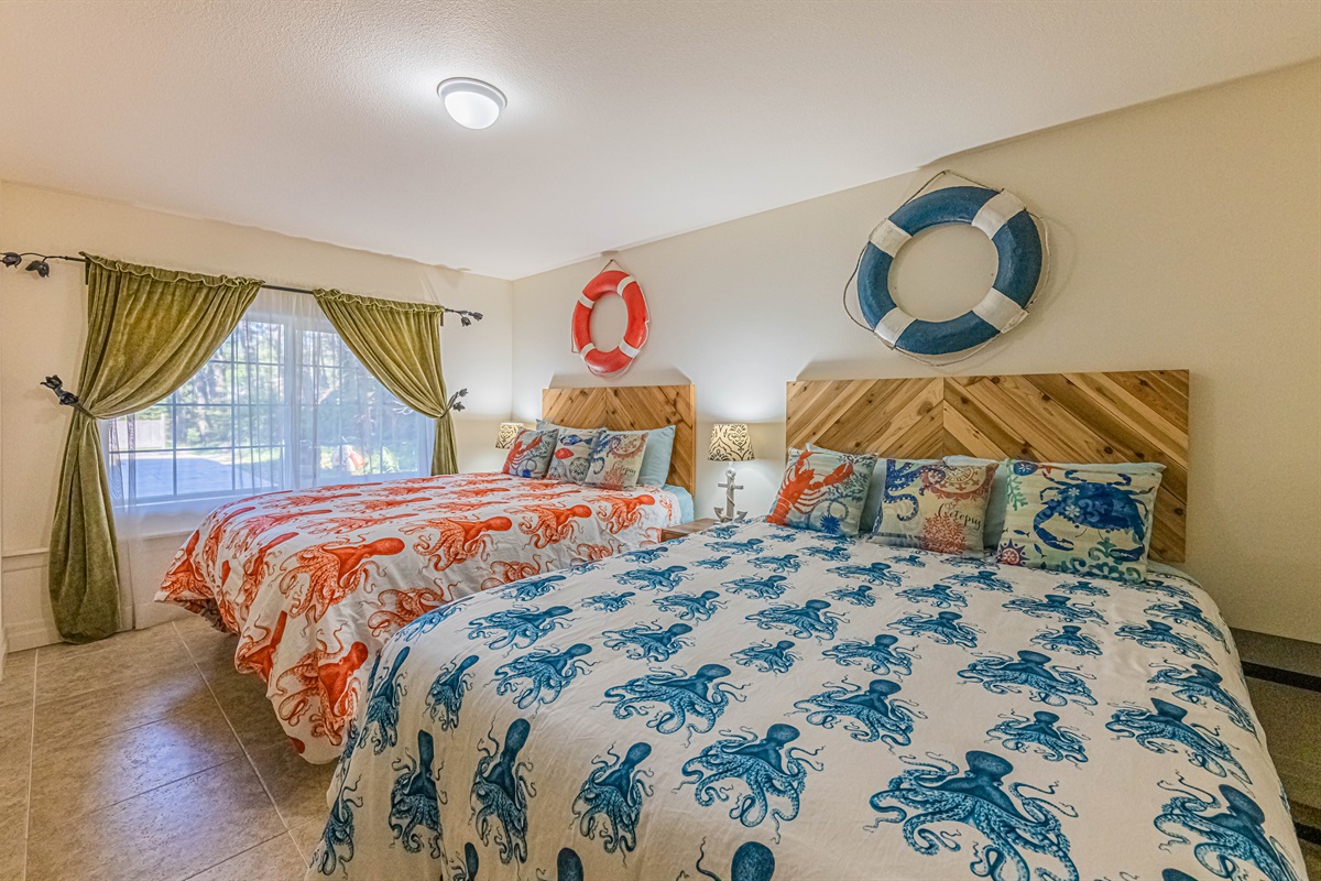 Basement bedroom is light and bright and complete with 2 comfy Queen size beds with memory foam mattress's and 55" TV.