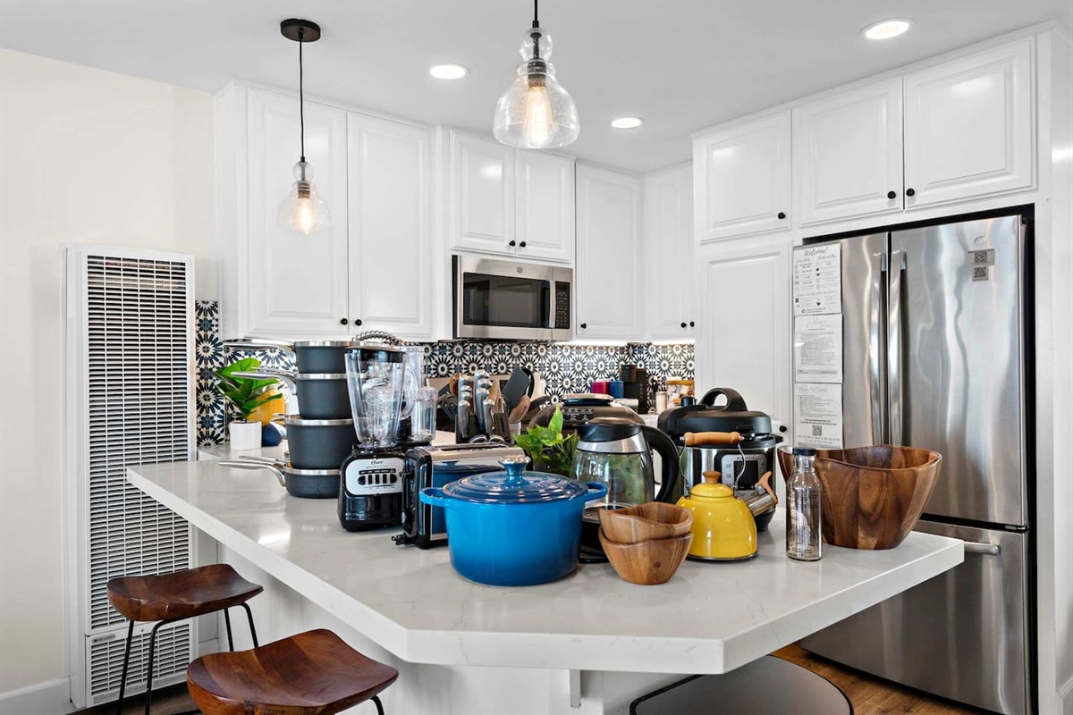 Our fully-stocked cook's kitchen has everything you need to cook delicious meals for your family. if you decide to eat in.  This photo is of a different kitchen but this condo has all of the same kitchen items.