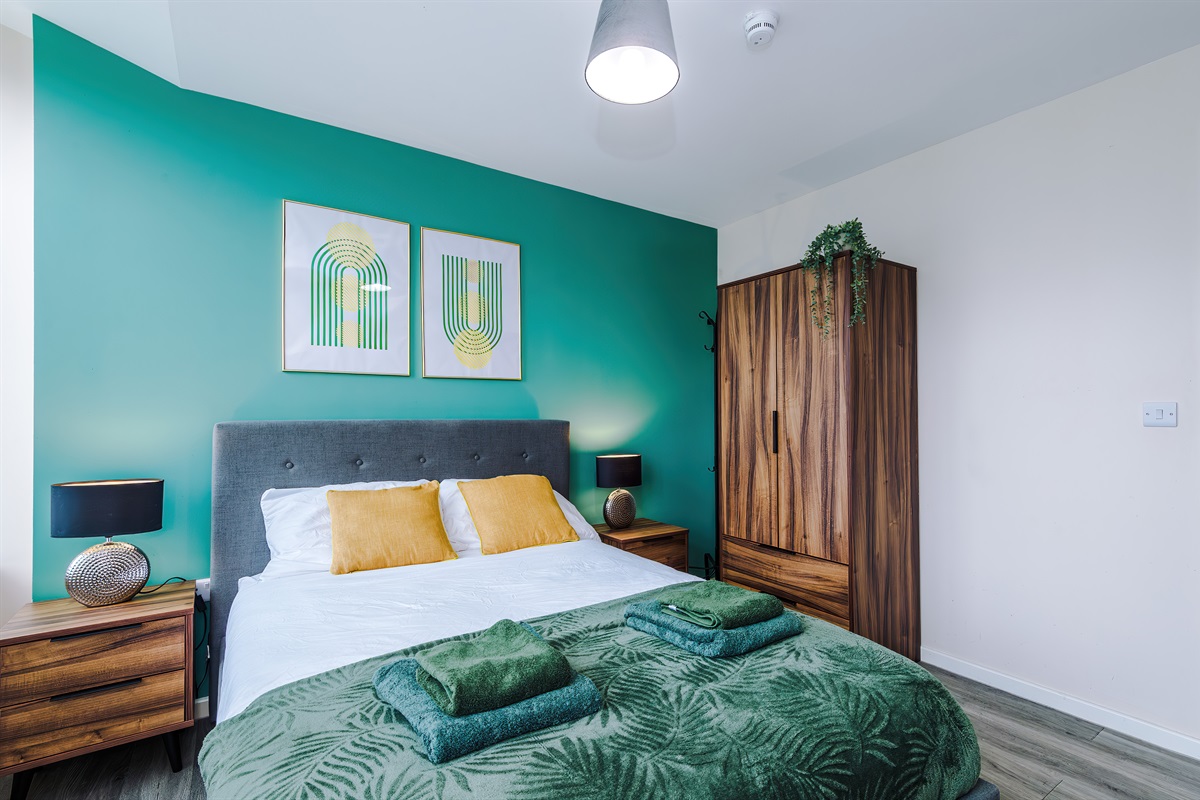 Bedroom 1 benefits from a hotel comfort large double bed, wardrobe with hangers & blackout blinds 