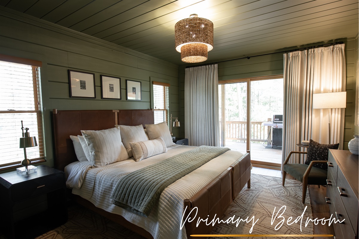 Soft green walls, luxury linens, and a king bed make Bedroom 1 a restful retreat where mornings come slowly.