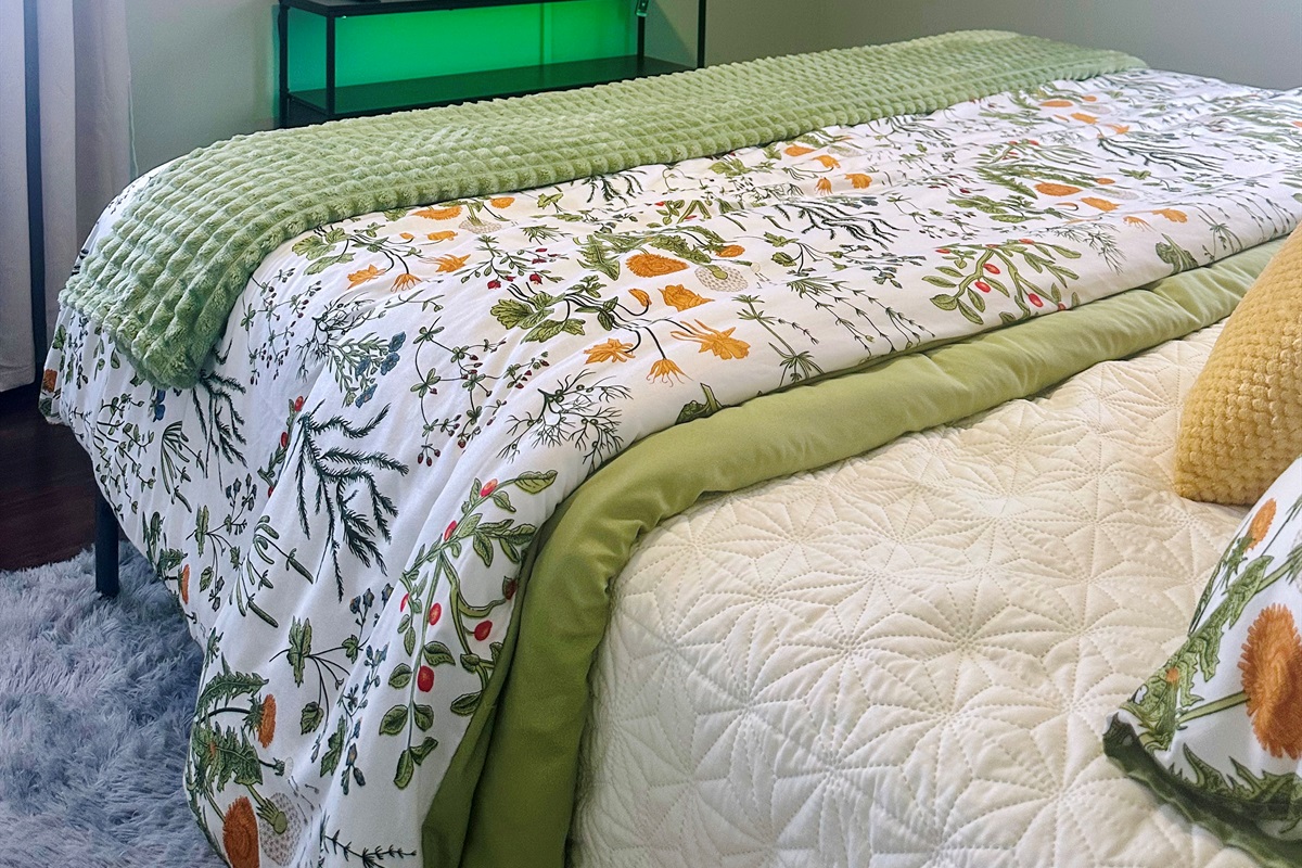 Primary bedroom featuring a wall-mounted TV for relaxed evenings and downtime. This photo highlights the added television, providing a comfortable private space for streaming, winding down, or quiet mornings.